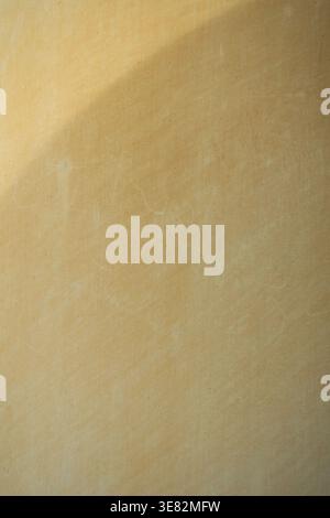 Warm beige textured wall with light gradient minimal background abstract surface soft aesthetic copy space Stock Photo