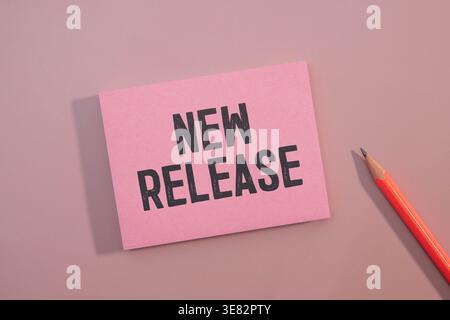 NEW RELEASE text on chalkboard on the wooden background Stock Photo