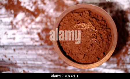 Natural Light Highlighting Fine Cocoa Granules And Rustic Textured Background Stock Photo