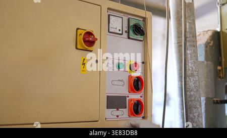 Industrial equipment control panel with emergency stop button Stock Photo