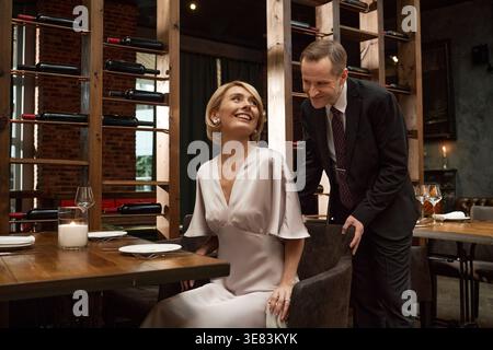 Adult Couple Enjoying Romantic Dinner Date in Upscale Restaurant Stock Photo