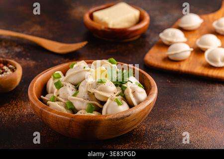 Homemade meat dumplings - russian pelmeni. Dumplings, filled with meat, ravioli. Stock Photo
