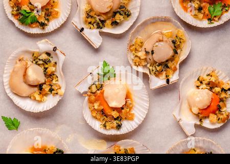 Cooked scallops with sauce on a baking sheet Stock Photo