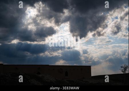 Dramatic dark clouds with penetrating rays of light. Stock Photo