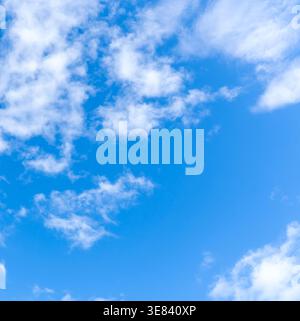 Low angle view and full frame of beautiful blue sky with strange shape of fluffy white clouds in the afternoon on sunny day Stock Photo