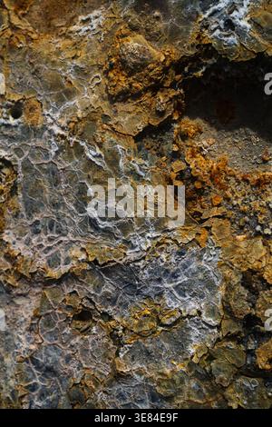 View of earth's raw canvas, where ochre and rust dance with veins of silver, a silent symphony etched in stone, Hrunamannahreppur, Hrunamannahreppur, Stock Photo