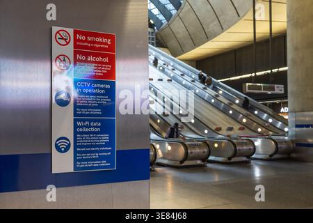 Rules sign by escalators in a modern subway station Stock Photo