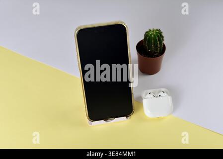 Modern workspace featuring cellphone setup Stock Photo