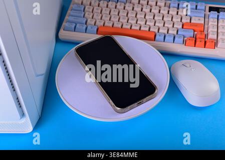 Modern workspace featuring cellphone Stock Photo
