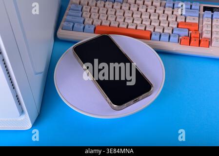 Modern workspace featuring cellphone Stock Photo