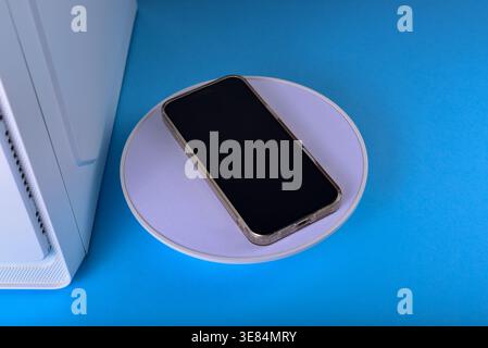 Modern workspace featuring cellphone Stock Photo