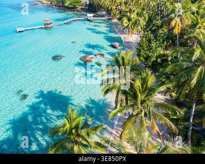 Aerial view of a tropical lagoon with turquoise water surrounded by ...