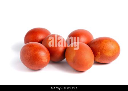 Multiple brown chicken eggs lying together in a heap on white background. Stock Photo