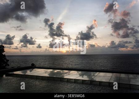 Landscape shot of the beautiful sunset dark cloudy sky with Andanman ocean background. Stock Photo