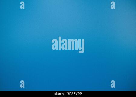 Blue textured gradient background with soft grain noise and vignette, abstract backdrop with copy space Stock Photo