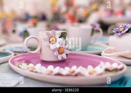 Colorful Decorated Coffee Cups with Floral Details on Table. High quality photo Stock Photo