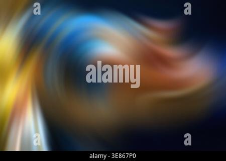 Colorful abstract swirl with vibrant gradients of blue, yellow, and orange, creating a dynamic and fluid design. Perfect for backgrounds and surreal a Stock Photo