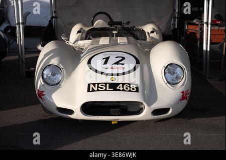 Front view of a white Lister Knobbly Chevrolet classic sports racing car with racing number 12 and license plate NSL 468, parked under a canopy in a p Stock Photo