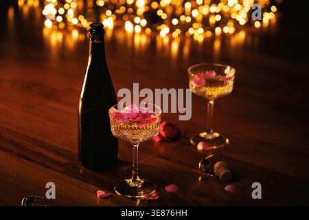Romantic Champagne Toast with Rose Petals Stock Photo