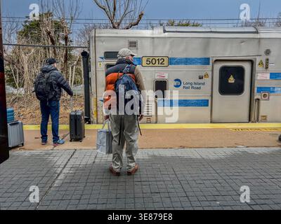 East Hampton, New York, USA, Senior Citizens, Man Standing, Alone, from behind, Waiting  Traveling, Train Station Platform, LIRR tourism in hamptons Stock Photo
