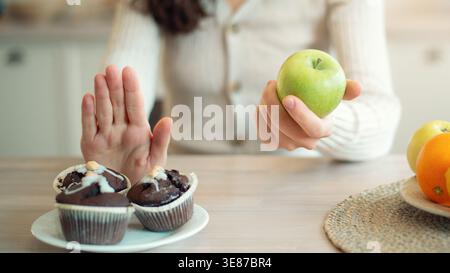 Making Healthy Choices With Fruits and Desserts at a Kitchen Table in the Morning Stock Photo