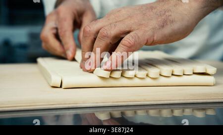 hands preparing dough for French chocolate bread Stock Photo