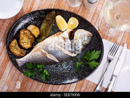Delicious grilled gilthead bream with lemon Stock Photo