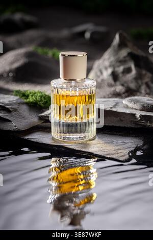 Untamed golden perfume symbolizing freedom and independence. Perfume at water in moon landscape. Stock Photo
