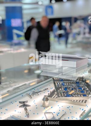 Dental surgical tray with instruments and book on glass table Stock Photo