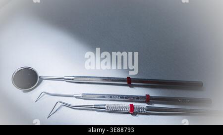 Dental instruments set on white background, mirror and probes for oral examination, clean medical concept Stock Photo