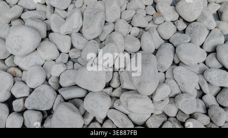 Smooth white and gray sea stones background Stock Photo