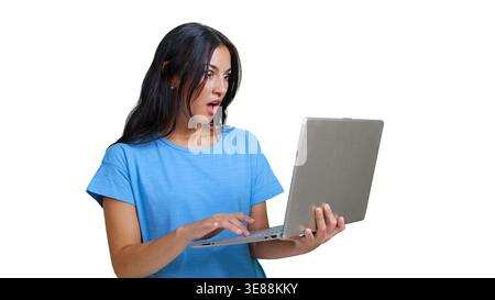 Woman reacting with surprise while using laptop Stock Photo