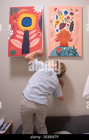 Searching for the Afikoman a traditional ritual during the Seder representing the story of the Exodus during the Jewish Passover - Pesach holiday Stock Photo