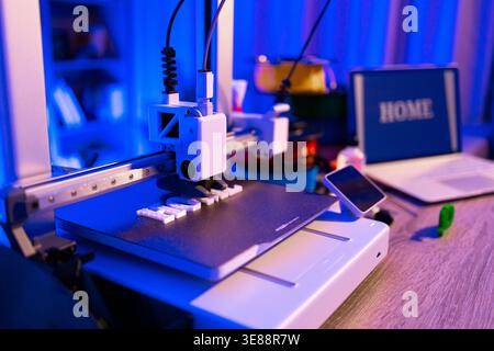 3D Printer Creating Home Letters Stock Photo