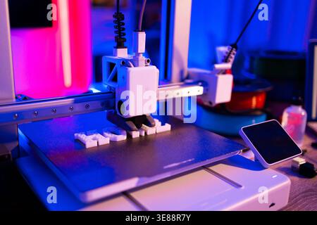 3D Printer Creating Letters Stock Photo