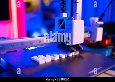 3D Printer Creating White Letters Stock Photo