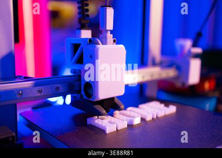3D Printer Creating White Letters Stock Photo