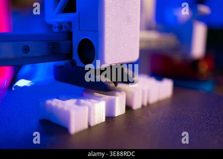 3D Printer Creating White Objects Stock Photo