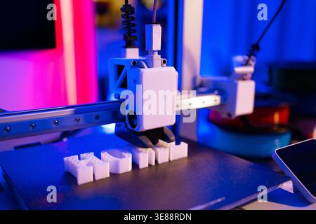 3D Printer Creating White Letters Stock Photo