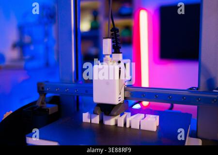 3D Printer Creating White Letters Stock Photo