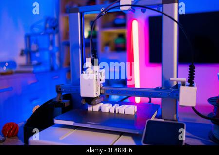 3D Printer Creating White Letters Stock Photo