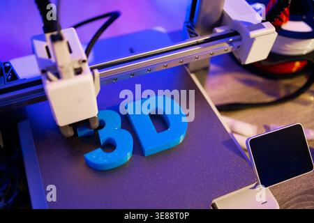 3D Printer Creating Letters Stock Photo
