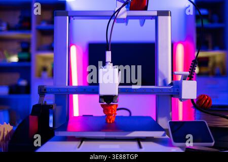 3D Printer Creating Cat Figurine Stock Photo