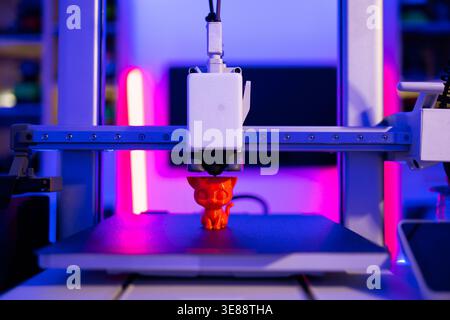 3D Printer Creating Cat Figurine Stock Photo