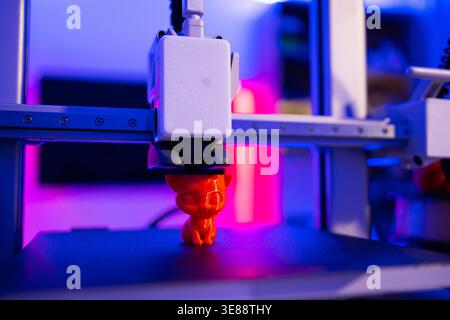 3D Printer Creating Cat Figurine Stock Photo