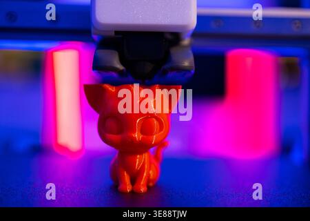 3D Printer Creating Cat Figurine Stock Photo
