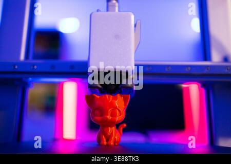 3D Printer Creating Cat Figurine Stock Photo