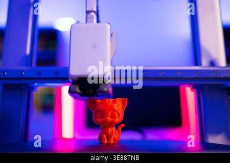 3D Printer Creating Cat Figurine Stock Photo