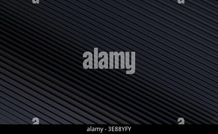 Abstract dark gray background with parallel diagonal lines and 3d texture effect Stock Photo