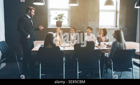 Business colleagues discussing project plans in office Stock Photo